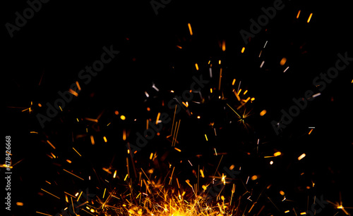 Photo Sparks from firework in front of black backgound