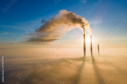 Fotografering Aerial view of coal power plant high pipes with black smoke moving up polluting