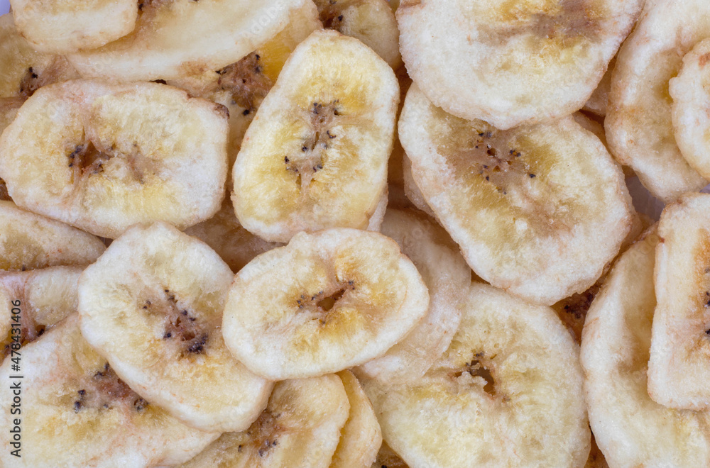 Background consisting of banana chips. Banana chips. Background consisting of banana chips. Banana chips.