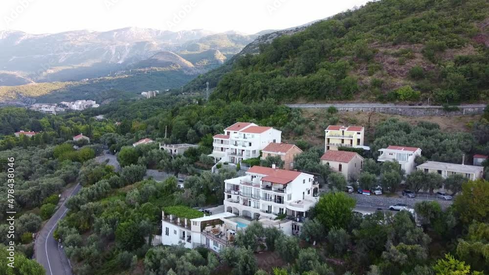 European resorts with beaches located at the foot of the mountains. Aerial view. Drone Shot of Sveti Stefan (Saint Stephen)in Montenegro. European resorts with beaches located at the foot of the mountains. Aerial view. Drone Shot of Sveti Stefan (Saint Stephen)in Montenegro.