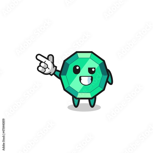 emerald gemstone mascot pointing top left