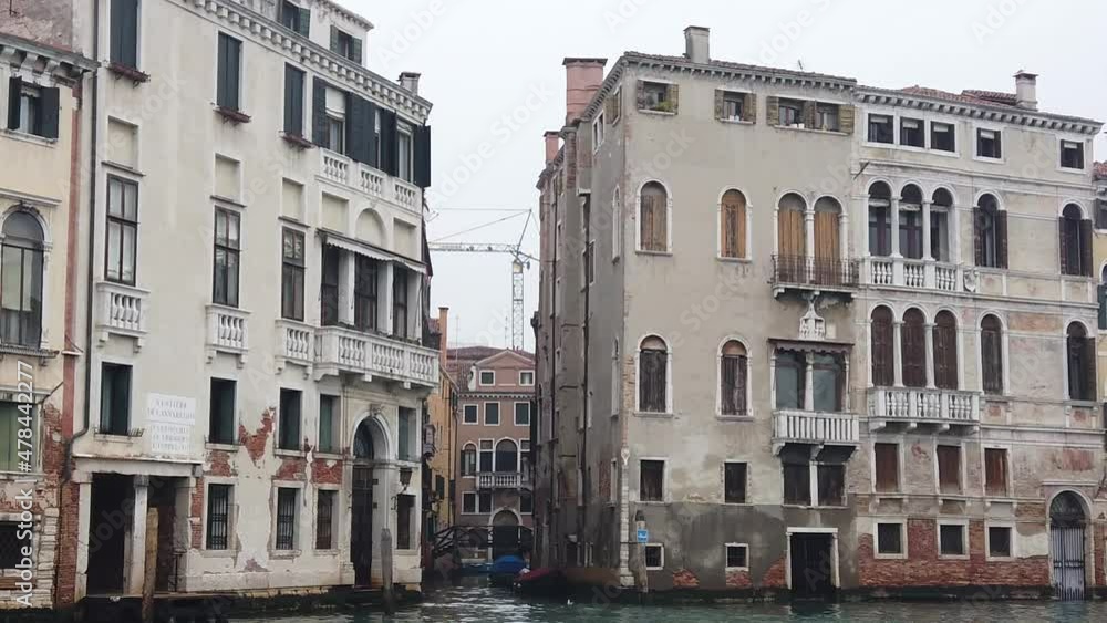 Venice, Italy - January 2022 - Traveling on the public transport boat, along the Grand canal, among the splendid historic buildings of the lagoon city Venice, Italy - January 2022 - Traveling on the public transport boat, along the Grand canal, among the splendid historic buildings of the lagoon city