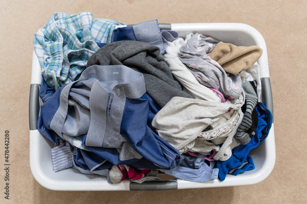 Laundry Basket with freshly washed clothes to dry Laundry Basket with freshly washed clothes to dry