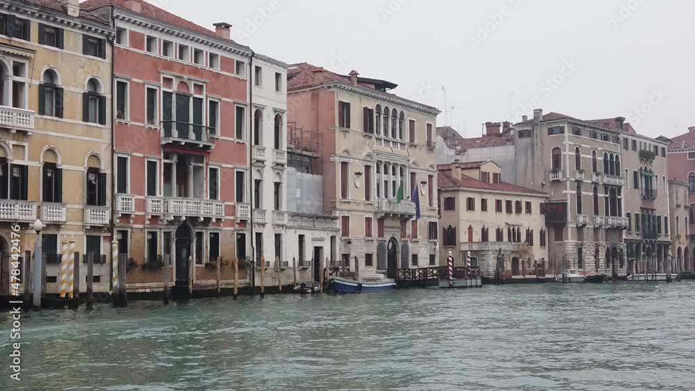 Venice, Italy - January 2022 - Traveling on the public transport boat, along the Grand canal, among the splendid historic buildings of the lagoon city Venice, Italy - January 2022 - Traveling on the public transport boat, along the Grand canal, among the splendid historic buildings of the lagoon city