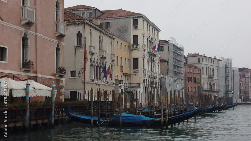Venice, Italy - January 2022 - Traveling on the public transport boat, along the Grand canal, among the splendid historic buildings of the lagoon city Venice, Italy - January 2022 - Traveling on the public transport boat, along the Grand canal, among the splendid historic buildings of the lagoon city