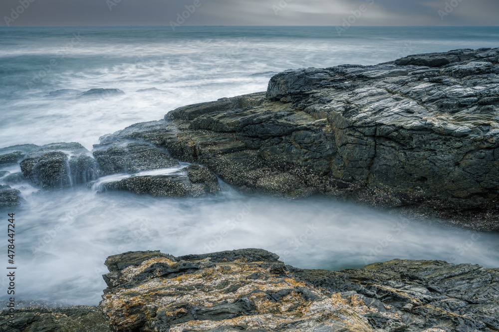waves and rocks in long exposure waves and rocks in long exposure