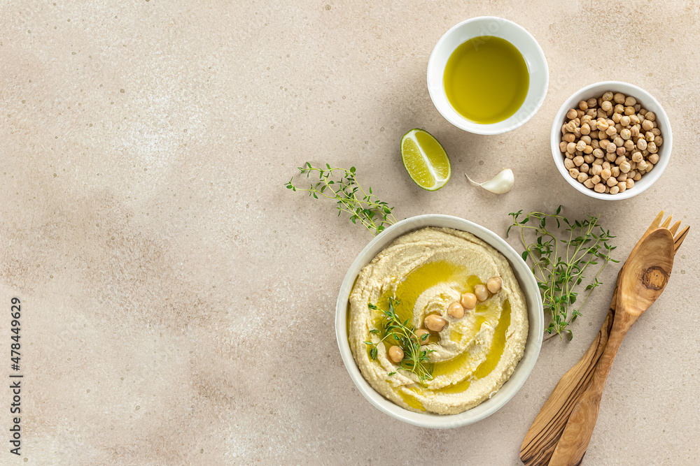 Lebanese Hummus, mashed chickpeas with lime, spices, olive oil, and herbs. homemade recipe, healthy snack. Top view, copy space. Lebanese Hummus, mashed chickpeas with lime, spices, olive oil, and herbs. homemade recipe, healthy snack. Top view, copy space.
