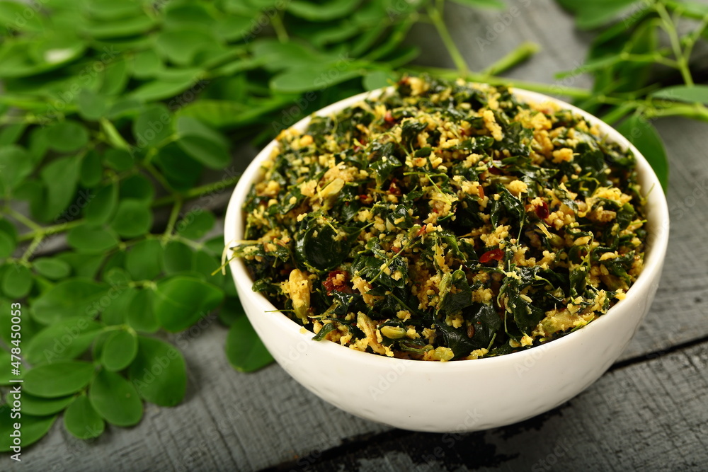Muringayila thoran- homemade delicious Moringa oleifera leaves stir fry with coconut and herbs. Muringayila thoran- homemade delicious Moringa oleifera leaves stir fry with coconut and herbs.