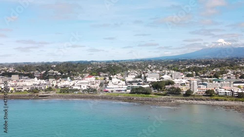 New Plymouth, Taranaki, New Zealand. Aerial cityscape of city on the shore, sunny day photo