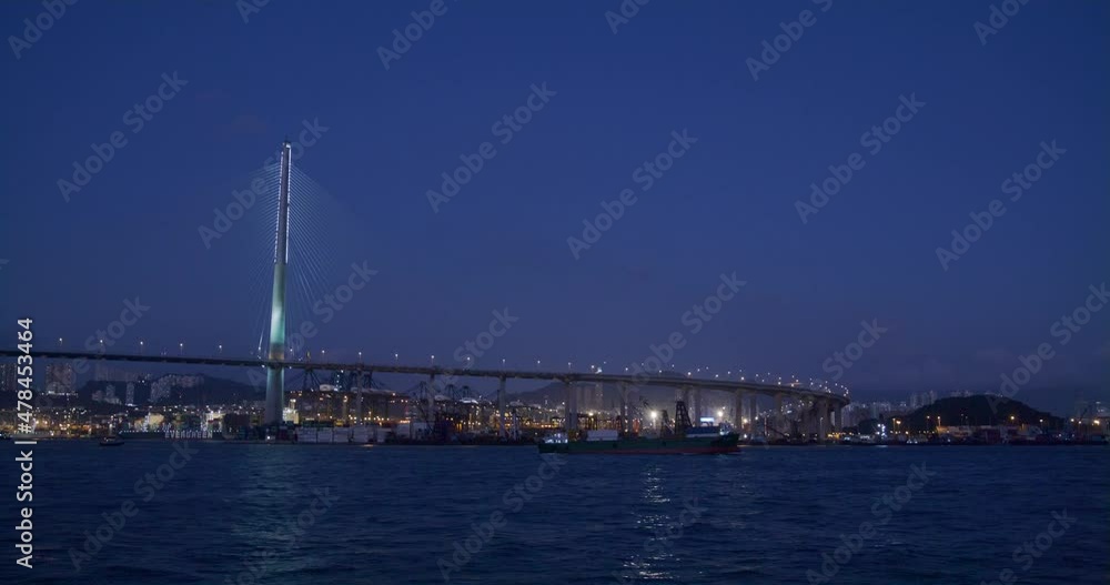 Take boat cross the harbor with Stonecutters Bridge in Hong Kong at night Take boat cross the harbor with Stonecutters Bridge in Hong Kong at night