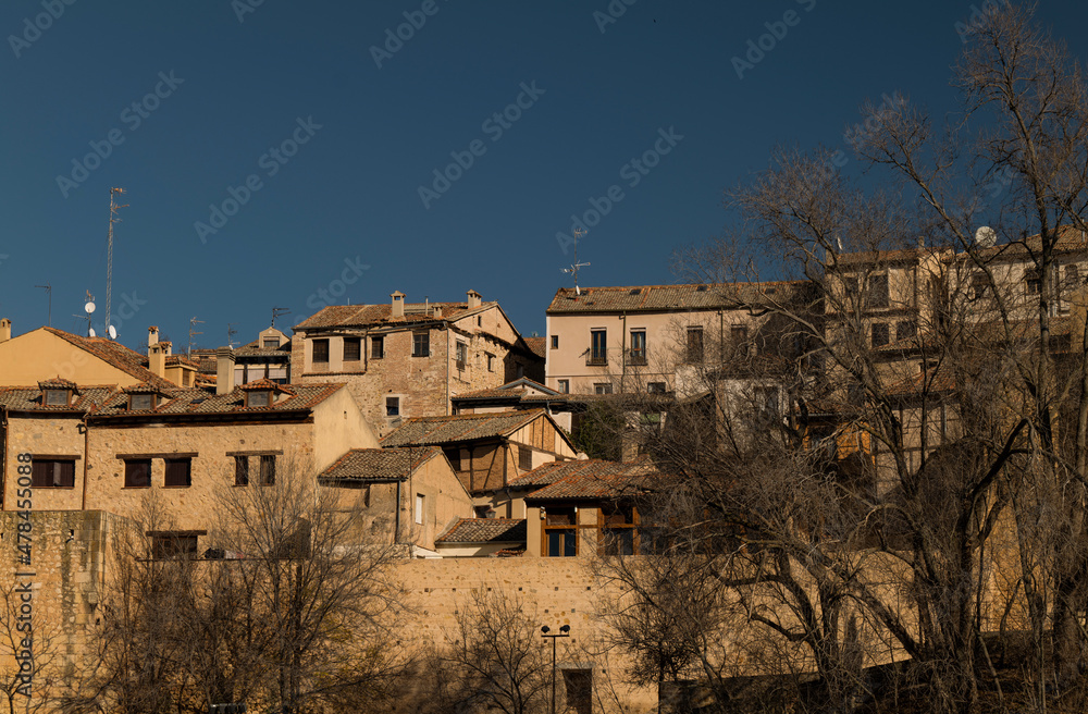 City skyline of Segovia, Spain, against blue sky