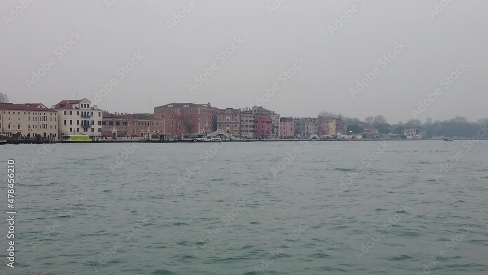 Venice, Italy - January 2022 - Traveling on the public transport boat, along the Grand canal, among the splendid historic buildings of the lagoon city Venice, Italy - January 2022 - Traveling on the public transport boat, along the Grand canal, among the splendid historic buildings of the lagoon city