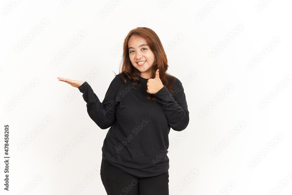 Showing recommended product on open palm Of Beautiful Asian Woman Wearing Black Shirt Showing recommended product on open palm Of Beautiful Asian Woman Wearing Black Shirt