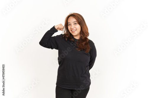 Showing strength arms Of Beautiful Asian Woman Wearing Black Shirt Isolated On White Background