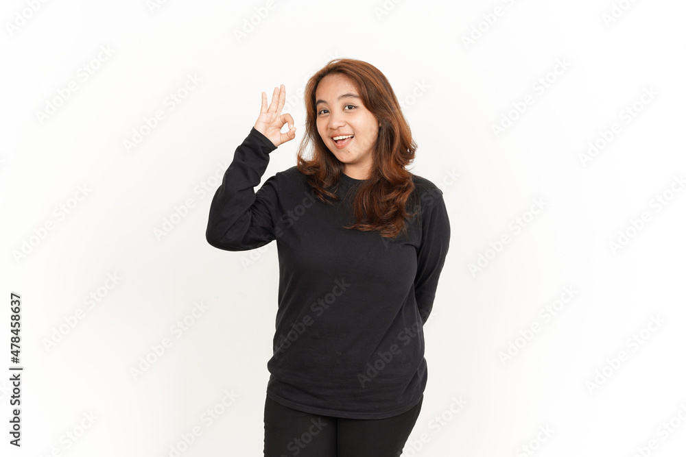 Showing OK Sign Of Beautiful Asian Woman Wearing Black Shirt Isolated On White Background Showing OK Sign Of Beautiful Asian Woman Wearing Black Shirt Isolated On White Background