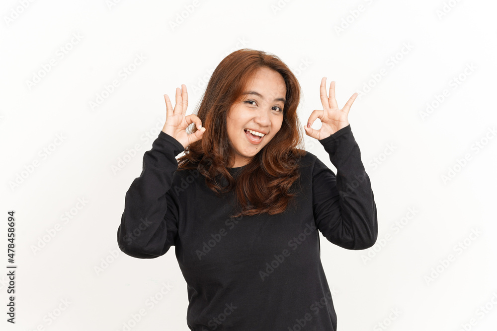Showing OK Sign Of Beautiful Asian Woman Wearing Black Shirt Isolated On White Background Showing OK Sign Of Beautiful Asian Woman Wearing Black Shirt Isolated On White Background