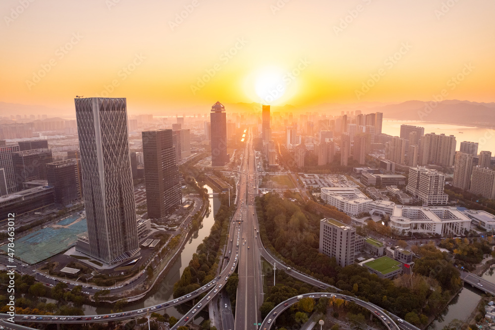 aerial view of elevated road and cityscape of hangzhou at sunset