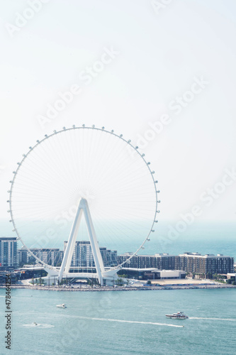 Dubai Eye Ferris wheel against blue sky © sashapritchard