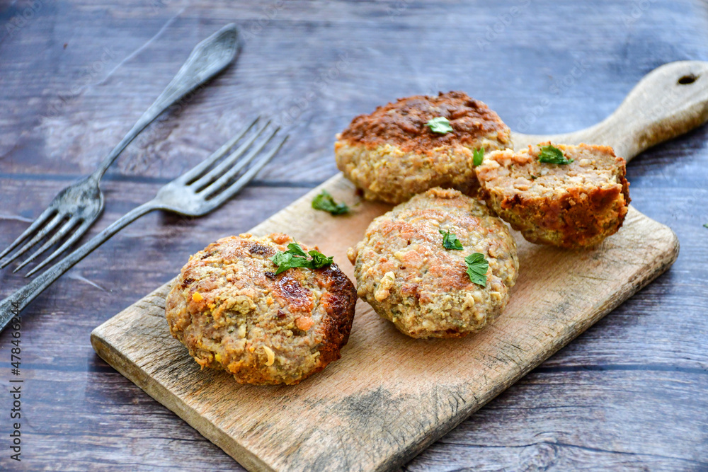 Home made fried meatballs on wooden rustic background.Cutlets from beef and pork meat. Home made fried meatballs on wooden rustic background.Cutlets from beef and pork meat.