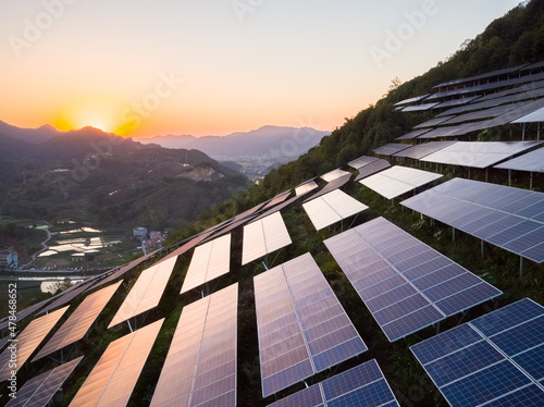 aerial view of solar power panels on hill