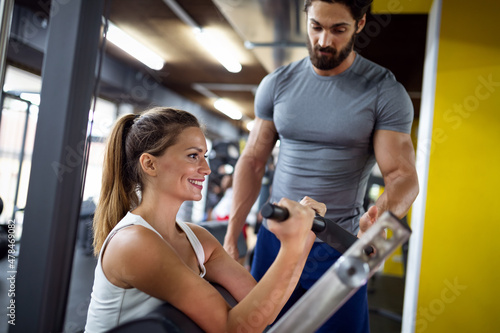 Portrait of happy fit people  friends exercising in gym together. Sport people workout concept