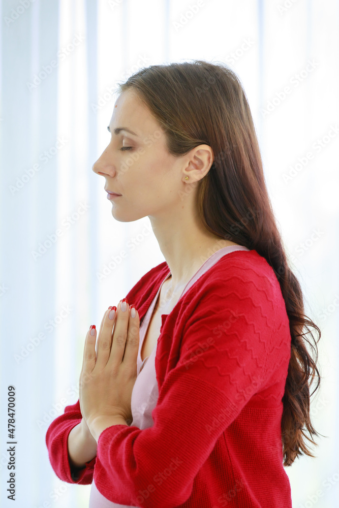 Caucasian millennial young happy female prenatal pregnant mother in casual pregnancy outfit with big belly tummy sitting crossed leg closed eyes smiling practice yoga meditation on bed in bedroom Caucasian millennial young happy female prenatal pregnant mother in casual pregnancy outfit with big belly tummy sitting crossed leg closed eyes smiling practice yoga meditation on bed in bedroom