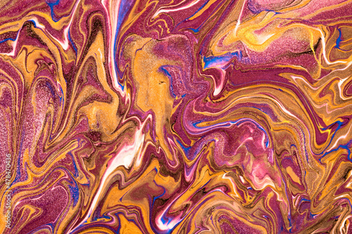 Abstract fluid art background light purple and golden colors. Liquid marble. Acrylic painting with orange lines
