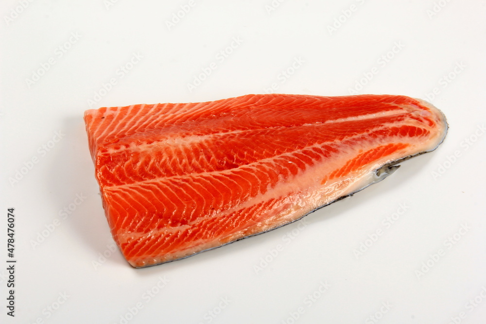 Raw trout fillet isolated on white background. Raw orange salmon fish fillet Raw trout fillet isolated on white background. Raw orange salmon fish fillet