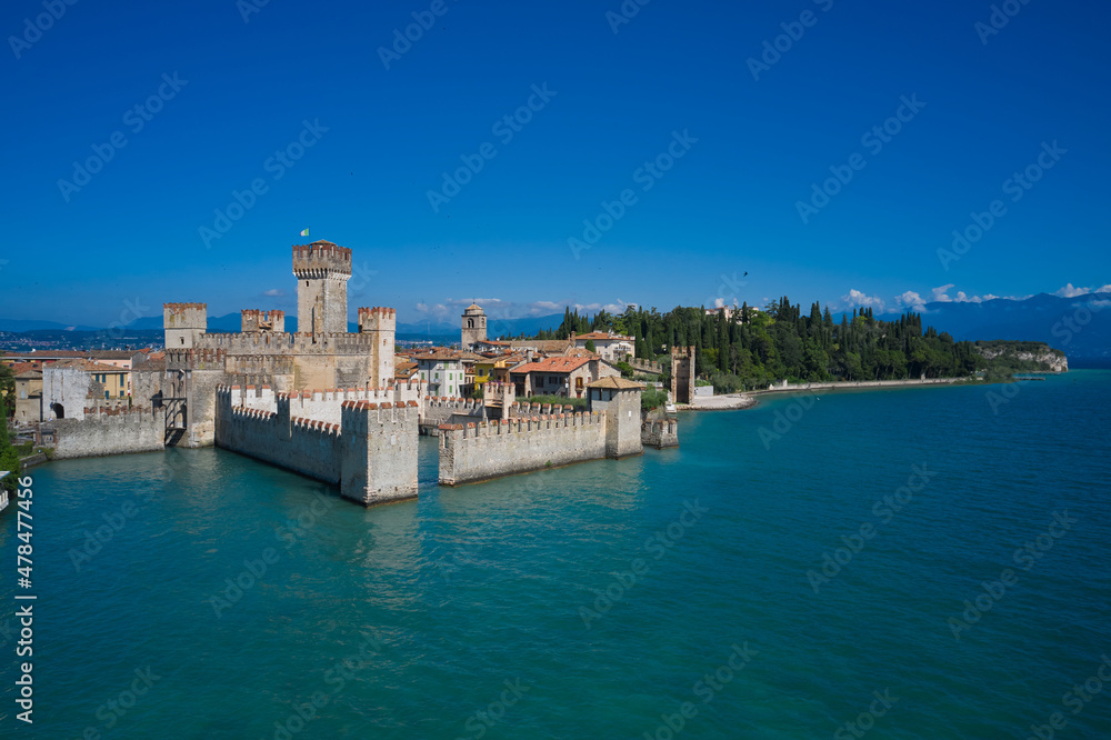 Aerial view on Sirmione sul Garda. Italy, Lombardy.Tourist destination in Lombardy region of Italy.  Rocca Scaligera Castle in Sirmione. Aerial photography with drone.