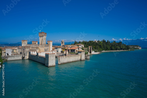 Aerial view on Sirmione sul Garda. Italy, Lombardy.Tourist destination in Lombardy region of Italy. Rocca Scaligera Castle in Sirmione. Aerial photography with drone.