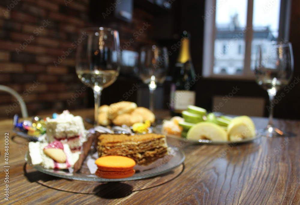 romantic dinner . sweets and alcohol on the table romantic dinner . sweets and alcohol on the table