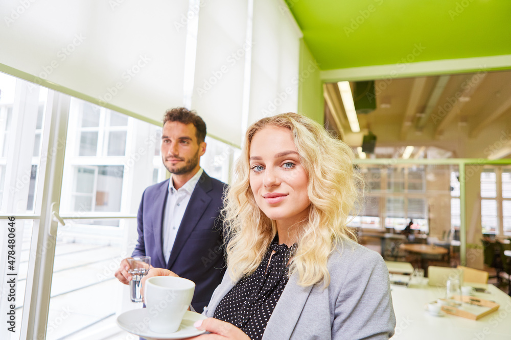 Business woman and a colleague on a coffee break Business woman and a colleague on a coffee break