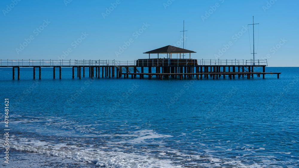 a pier on the beach and calming sea views