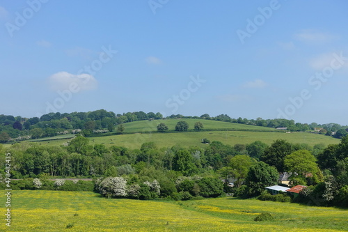 Scenic view of a green fields in the rolling English countryside - England is known for its picturesque green landscapes