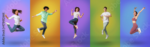 Happy multiracial young people jumping on different color neon backgrounds, panorama photo