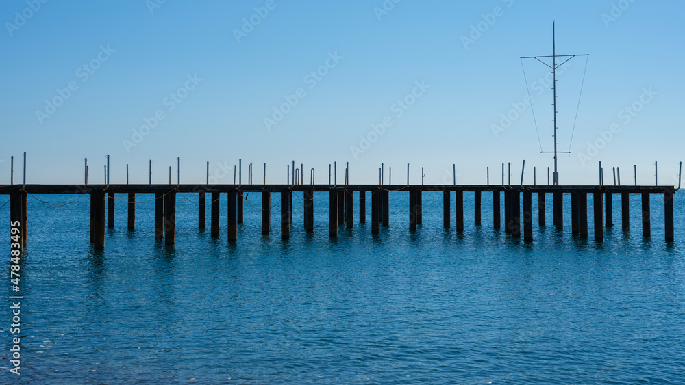 a pier on the beach and calming sea views