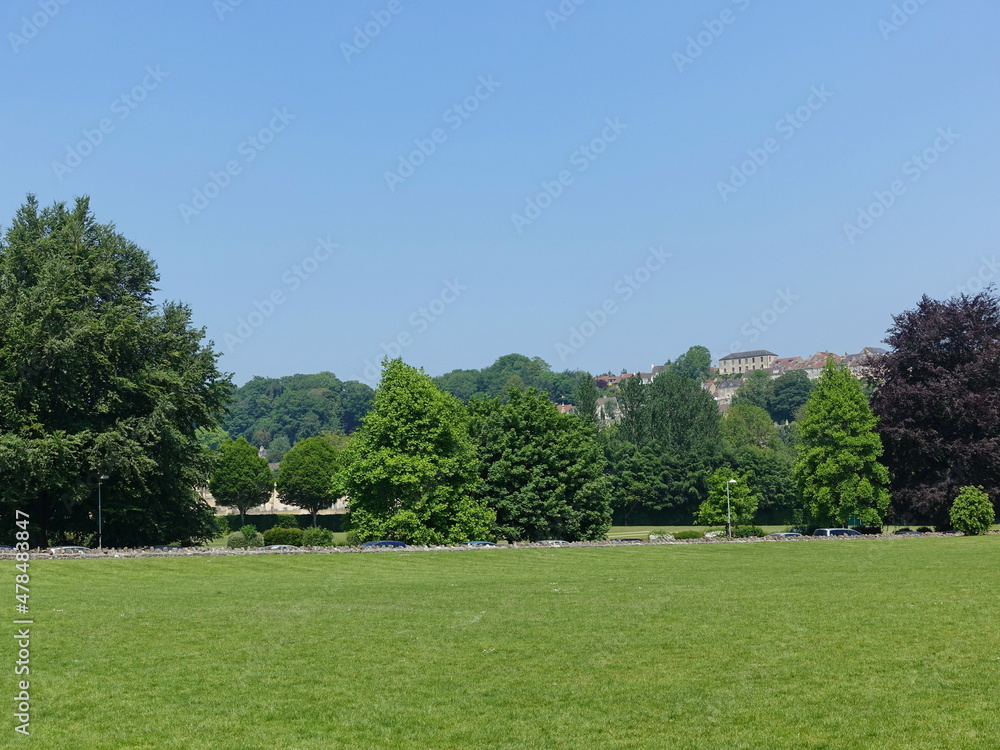 Scenic view of a green playing field in a park