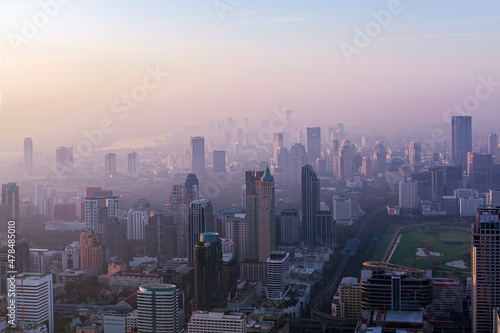 Dawn over Bangkok. At the height of a bird's flight. Smog hell city. 
