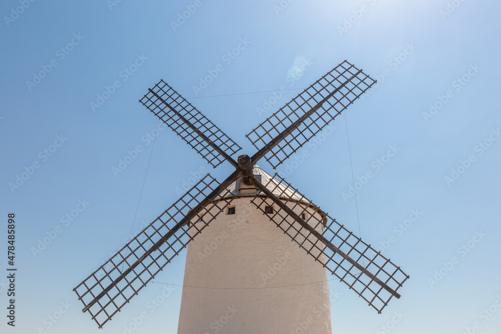 Close up view of a large white windmill