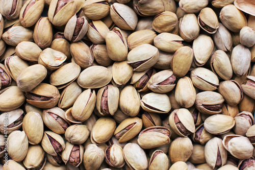 Pistachios texture and background . Tasty pistachios as background,as pistachios texture. flat lay