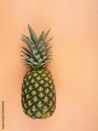 Creative copy space mockup with tropical fruit pineapple. For writing text in the concept of food on a yellow background.