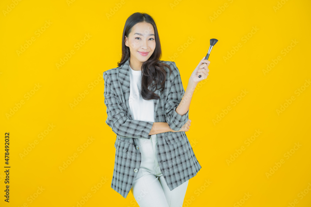 Portrait beautiful young asian woman with make up brush cosmetic Portrait beautiful young asian woman with make up brush cosmetic
