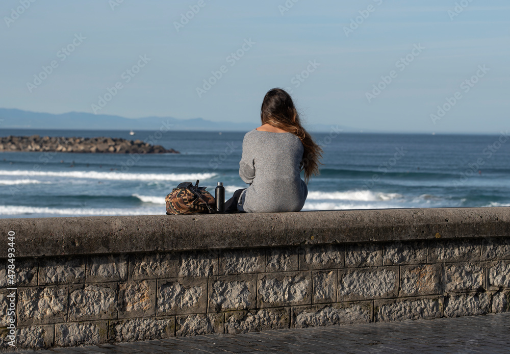 girl looking out to sea girl looking out to sea