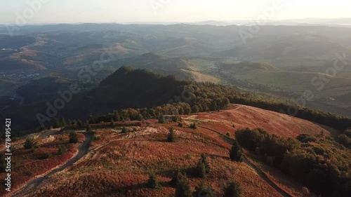 Ukraine Carpathians Borzhavsky ridge, drone flight over mountain meadows and mountains, drone flight around the building on top of the mountain, mountain top, morning, evening photo