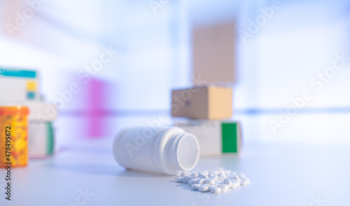 Fototapeta Naklejka Na Ścianę i Meble -  Pills an pill bottle on blurred background