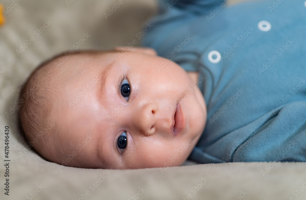 2 months old baby boy portrait. Adorable newborn baby boy looking at camera. 2 months old baby boy portrait. Adorable newborn baby boy looking at camera.