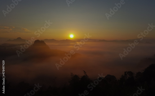 Landscape sunrise over mountains and warm morning sun