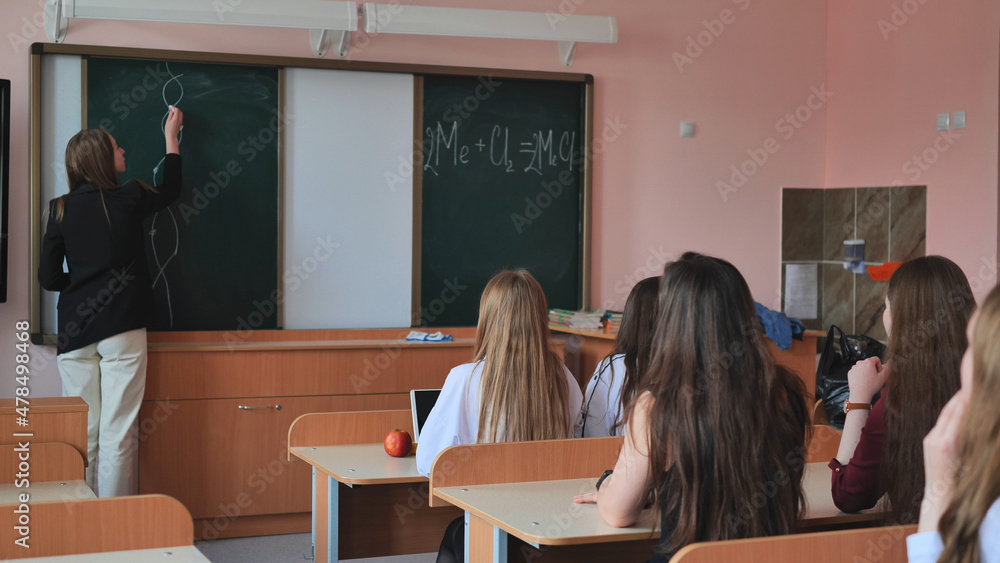Pupils of the 11th grade in the class at the desks during the lesson. Russian school. Pupils of the 11th grade in the class at the desks during the lesson. Russian school.