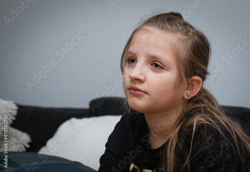Lovely caucasian girl (8 years old) posing, joy and thoughtfulness. Portrait.
