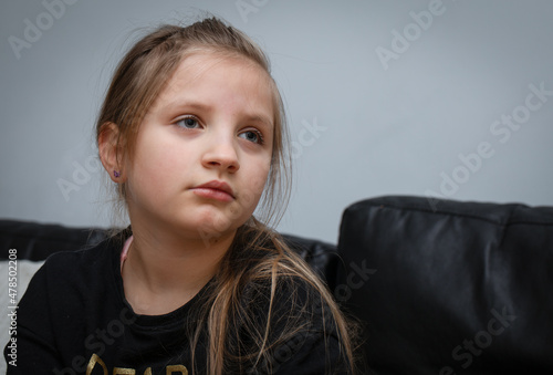 Lovely caucasian girl (8 years old) posing, joy and thoughtfulness. Portrait.